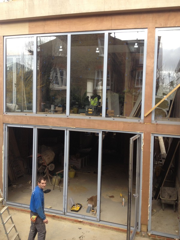 Aluminium bi-fold doors with two-storey glazing in Peckham
