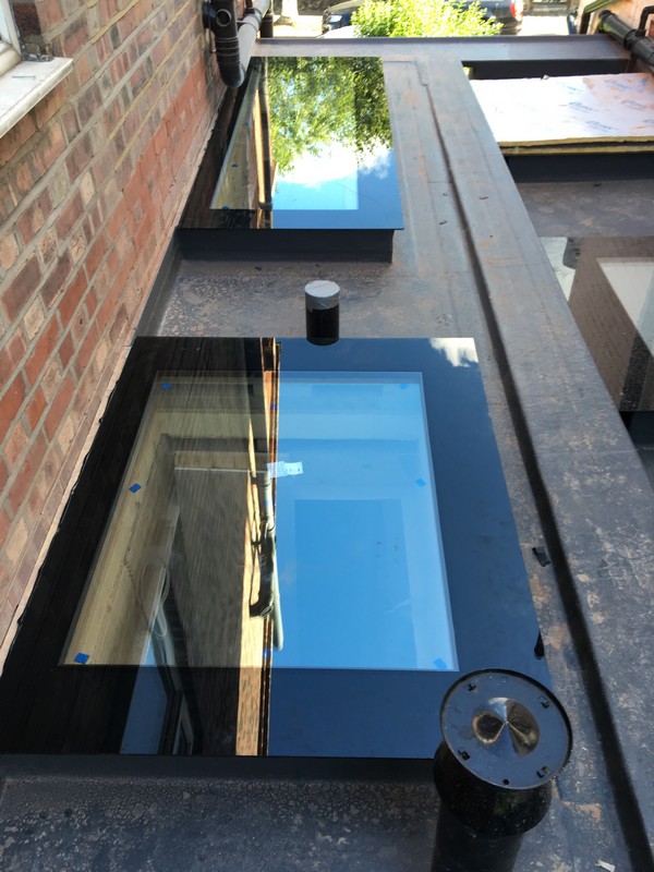 Multiple flat roof skylights on extension in Peckham